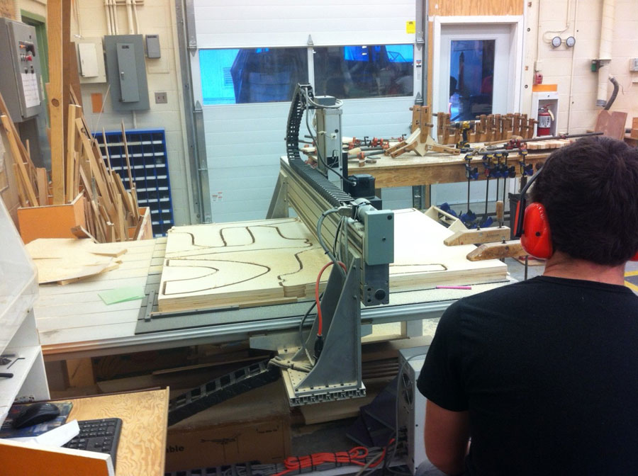 Thomas Bennett controls the Computer Numerical Controlled (CNC) router during Carpentry/Joinery 11/12 in block A