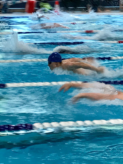 Nick competing in 100M Butterfly