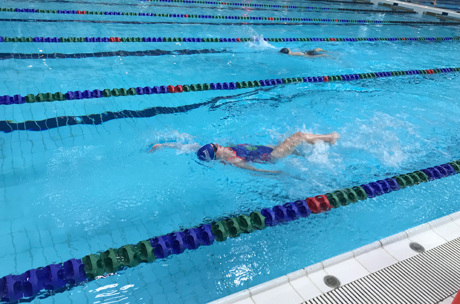 Kyla competing in the 50 Backstroke event.